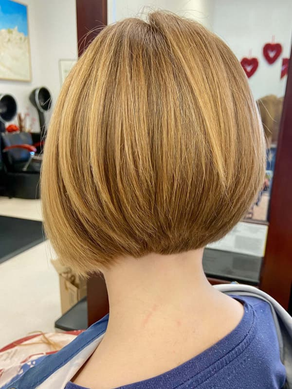 Modern bob haircut styled at Creative Hair & Spa