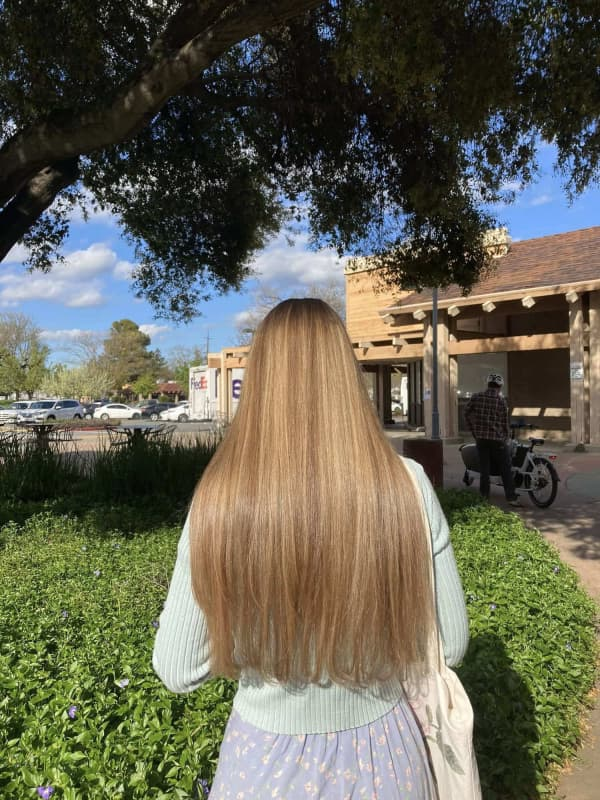 Sun-kissed blonde balayage finish by Creative Hair & Spa
